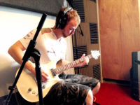 Aj playing electric guitar for But That's Just Me...